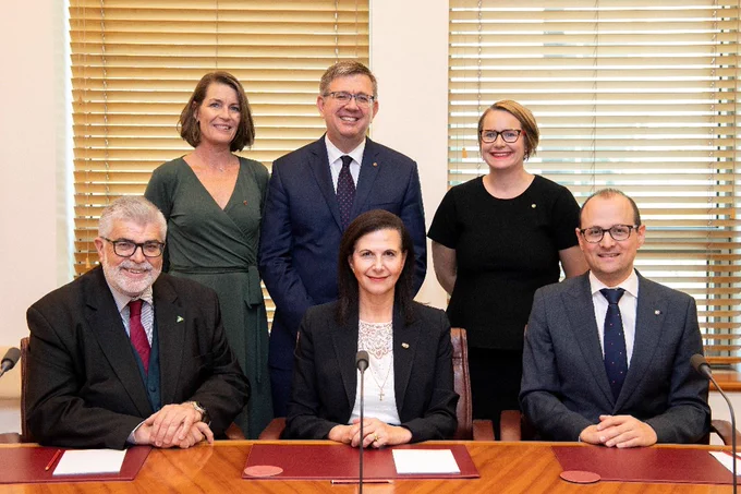 From L to R front row: Deputy Chair Senator the Hon Kim Carr, Chair Senator the Hon Concetta Fierravanti-Wells, Senator Raff Ciccone. Back row: Senators Perin Davey, Paul Scarr and former committee member Senator Nita Green. Photo courtesy of AUSPIC
