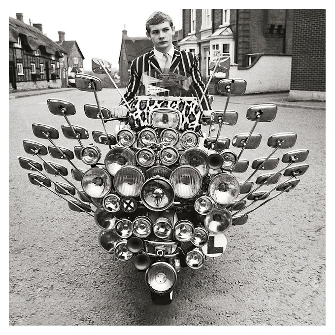 Mod from the 1970s with lots of mirrors attached to scooter