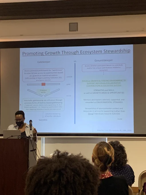 Dr Beronda Montgomery stands at a podium discussing the difference between gatekeeping and groundskeeping in graduate education.