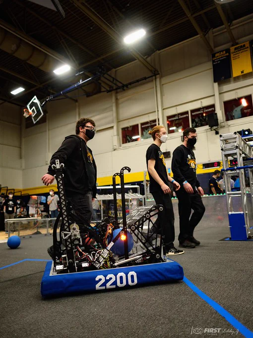 Drive team and robot on the field.