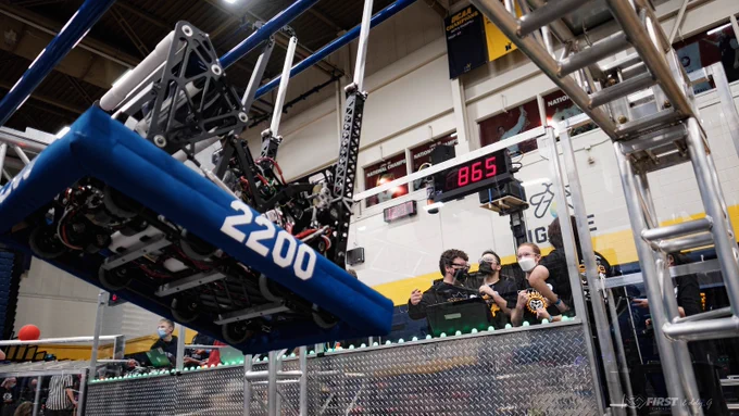 Our robot hanging with the drive team in the background.