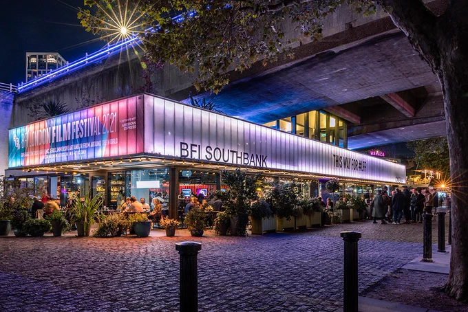 Exterior of BFI Southbank at night with BFI London Film Festival branding across the building