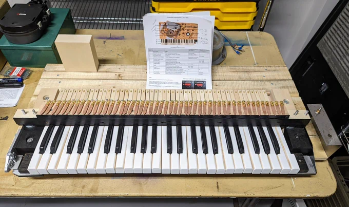 Reconstructed Electronic Sackbut keyboard on table in workshop.