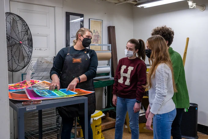 IOP students watch a presentation on poster printing at Bow and Arrow Press.