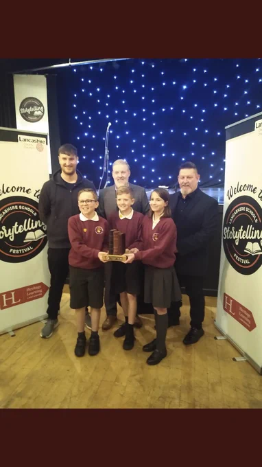 Children from Hapton primary class 4 with winners trophy