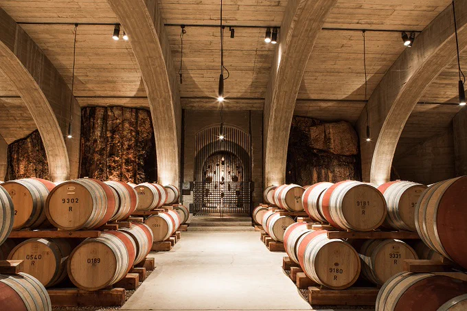 Photo of Mission Hill Family Estate Winery barrel room.