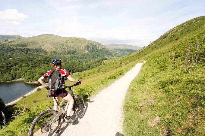 cyclist enjoying the view in the Lake District