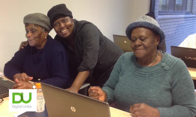3 ladies at computers