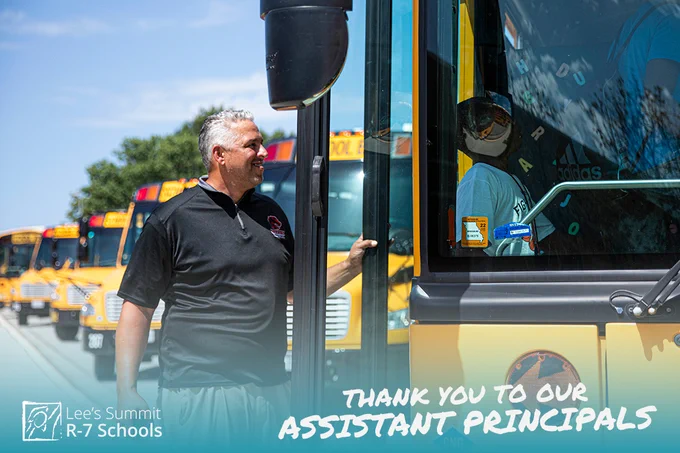 Man standing next to school bus