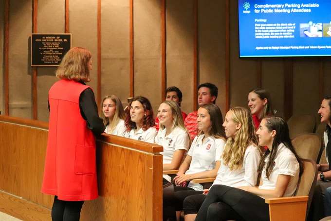 The Mayor of Raleigh speaking with the NC State women's cross country team 