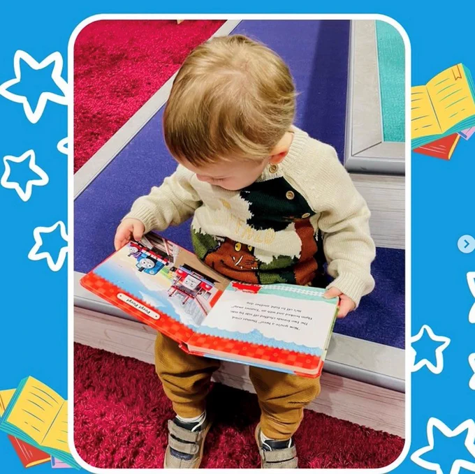 baby reading a book in Lichfield library