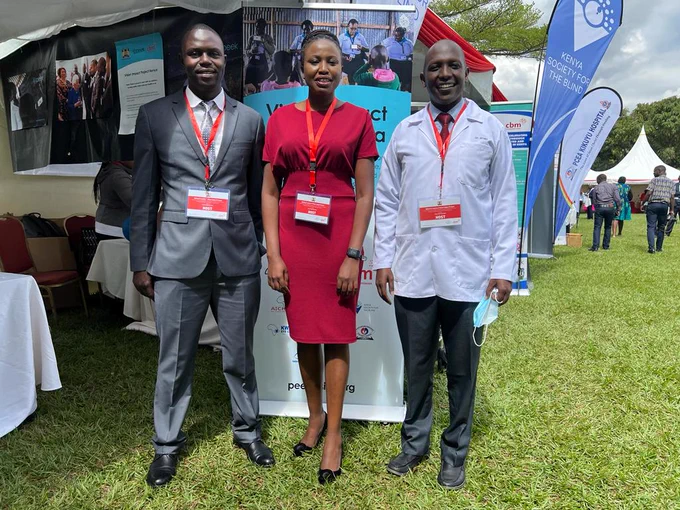 Peek team members in Kenya in from of the Peek exhibition booth at the launch of the Vision Impact Project for inclusive eye health.