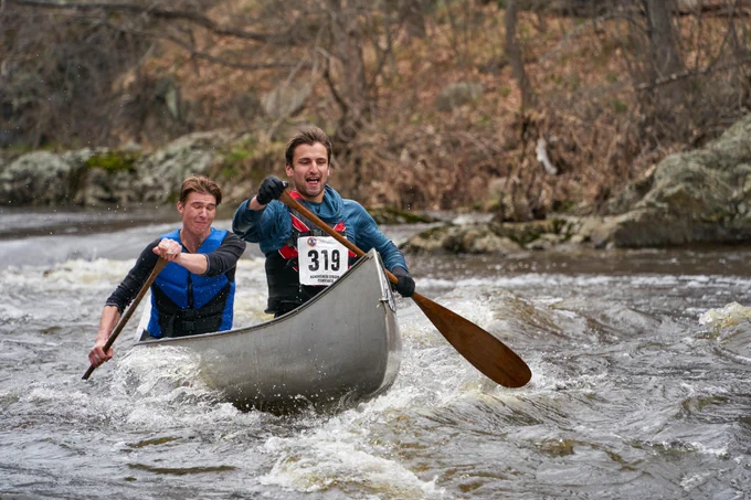 Christopher Erb and teammate paddle a canoe down the Kenduskeag Stream.