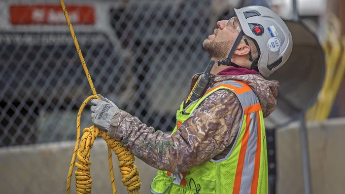 DPR SPW worker pays close attention as he assists with hoisting the CFMF panel into place. 