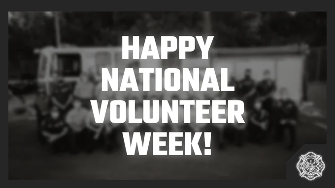 A blurred group photo with the text "happy national volunteer week."