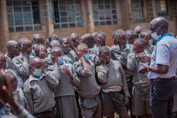 School children wait to have their vision screened in Uasin Gishu, Kenya.