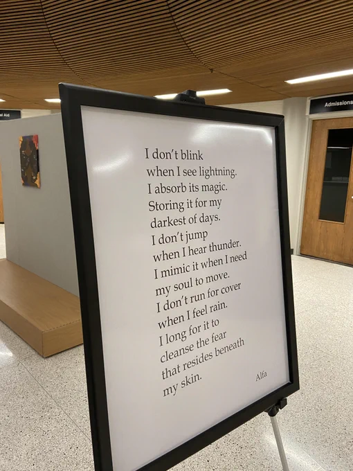Poem by Alfa: black words on a white background. It reads: I don't blink when I see lightening. I absorb its magic. Storing it for my darkest of days. I don't jump when I hear thunder. I mimic it when I need my soul to move. I don't run for cover when I feel rain. I long for it to cleanse the fear that resides beneath my skin.