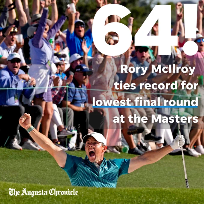 Rory McIlroy raising his arms in celebration from the bunker.