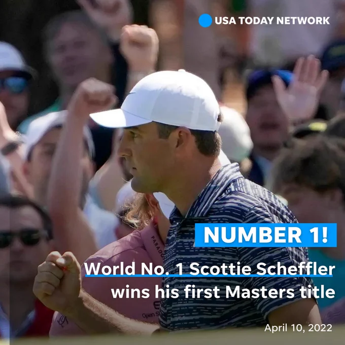 Scottie Scheffler pumping his fist.