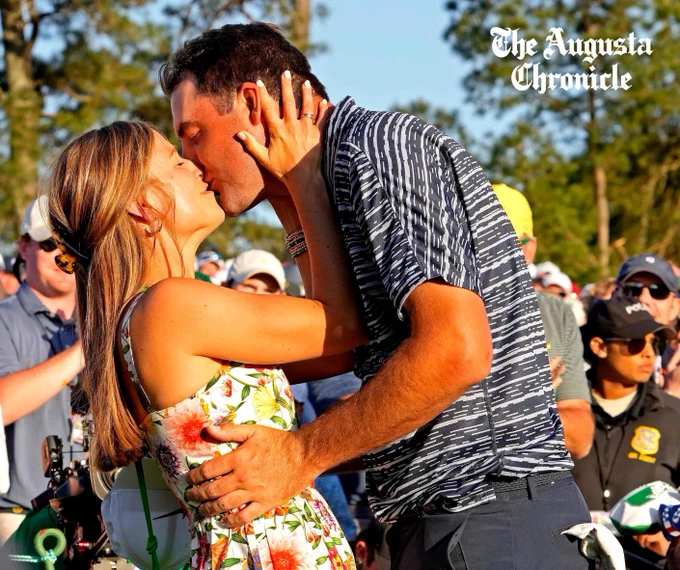 Scottie Scheffler kissing his wife after winning the Masters.