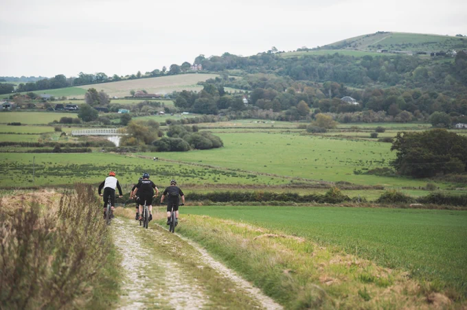 Mountain bikers descending a scenic trail