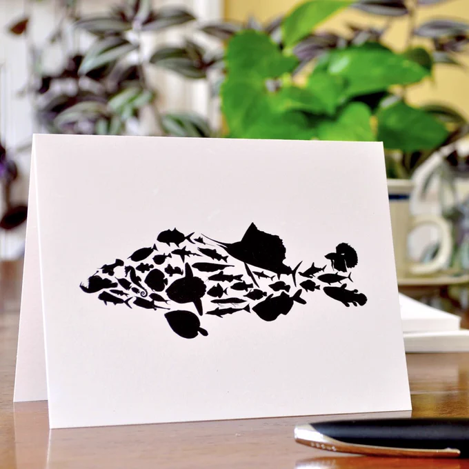 Photograph of a greeting card with an illustration of a fish