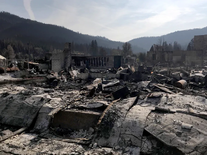 Destroyed and burned buildings in California town after fire.