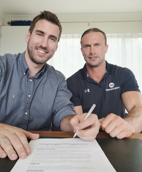 Jonathan Jansen from the New Zealand Esports Federation with Hamish Day from Code Avengers, after signing a partnership agreement