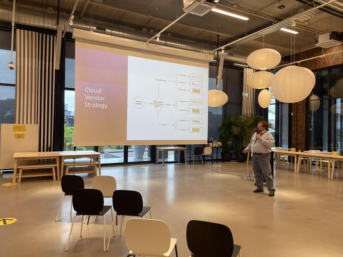 Speaker in front of a slide showing a decision tree entitled “cloud vendor strategy”