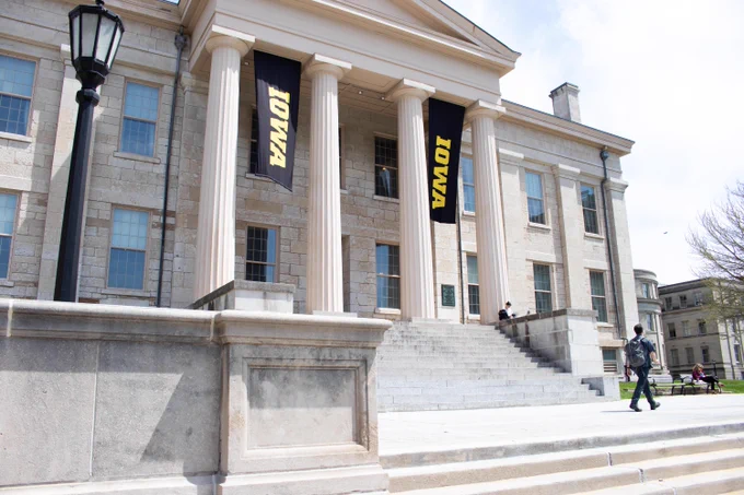 Back Old Cap looking east. Iowa banners hang from the building.
