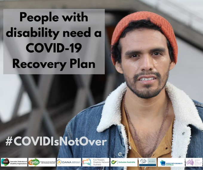 Person wearing a beanie. Text says People with disability need a COVID-19 Recovery Plan. #COVIDIsNotOver. Eight national disability peak logos at the bottom.