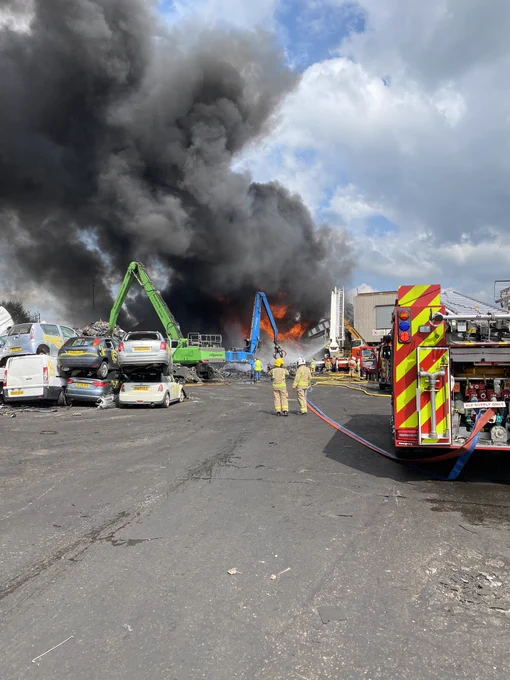 Firefighters, fire engine and a fire