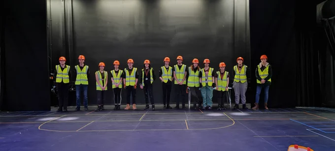 A picture of crew wearing hi-vis and hard hats in the Chroma-Q Theatre