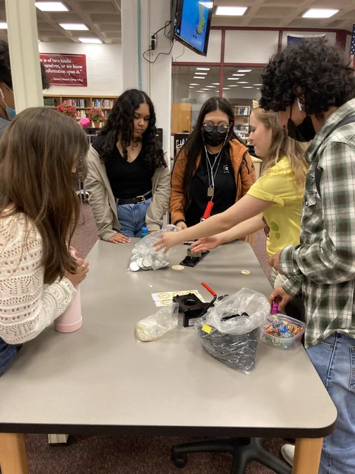 Ms. Neal helping students make Goofy Goober buttons 
