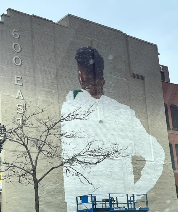 The Bucks, Milwaukee Downtown Business Improvement District #21, and 600 EAST are producing a new mural of Giannis Antetokounmpo in downtown Milwaukee. In the midst of being painted by nationally known contemporary artist Mauricio Ramirez, the 54’ by 56’ three-story artwork will feature Antetokounmpo on the east facade of the 600 EAST building, located at 600 E. Wisconsin Avenue.
