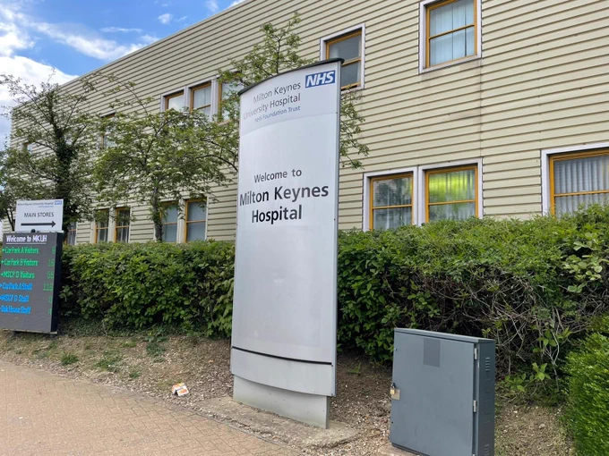 Main sign for Milton Keynes Hospital near the main entrance.