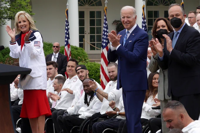 First Lady Dr. Jill Biden addresses Team USA at the White House for a celebration honoring 2020 and 2022 Olympic and Paralympic athletes. President Joe Biden, Vice President Kamala Harris and Second Gentleman Mr. Emhoff look on.