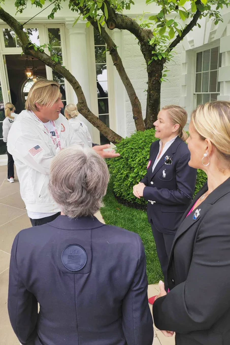 USOPC CEO Sarah Hirshland, USOPC Board Chair Susanne Lyons and SVP, Chief of Paralympic Sport Julie Dussliere speak with five-time Olympian Jesse Smith at the White House celebration.