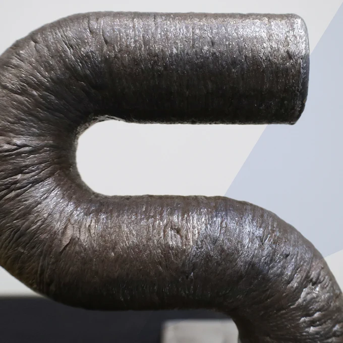 Wire Additive Manufactured, metal 3D printed 1.75D pipe. Material ER70