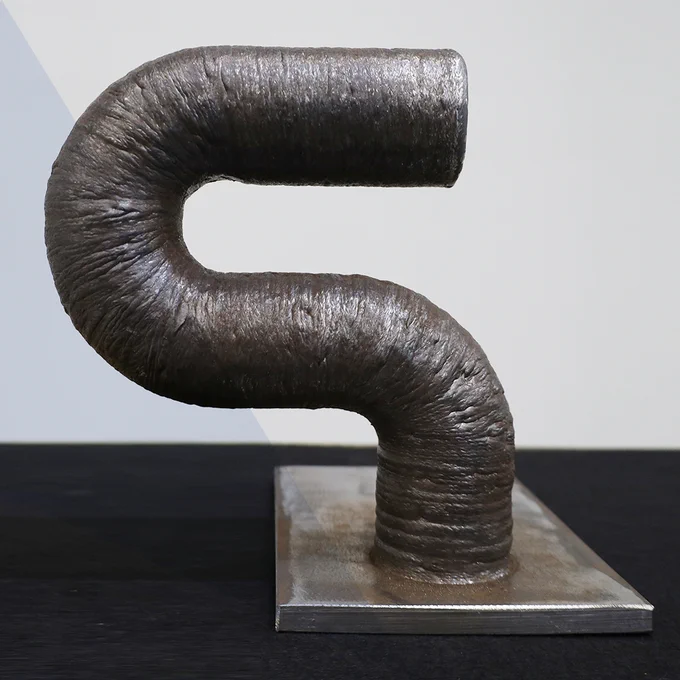 Wire Additive Manufactured, metal 3D printed 1.75D pipe. Material ER70