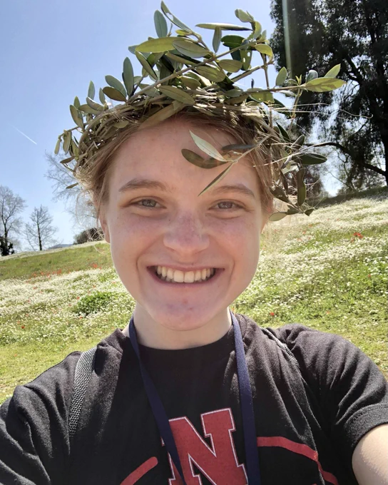 Julia wearing laurel wreath.
