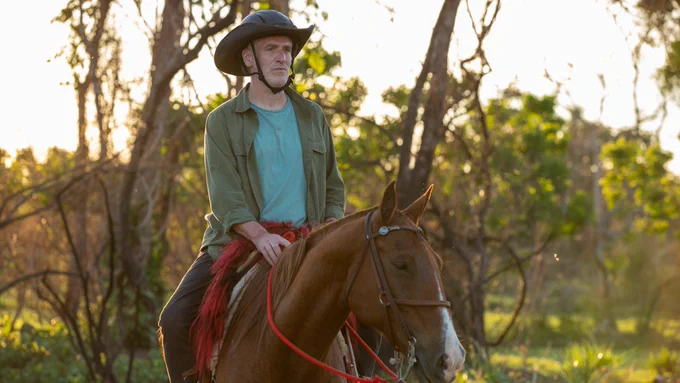 Presenter Gordon Buchanan riding a horse.