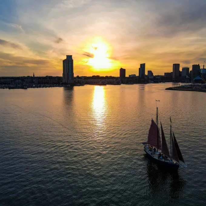 Gaffer cruising through the harbor. Sunset on a great conference.