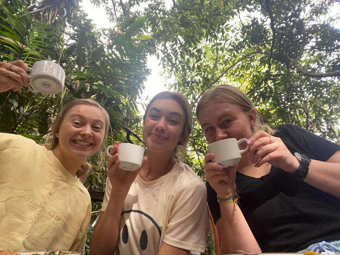 Three Husker students enjoy coffee together in Costa Rica.