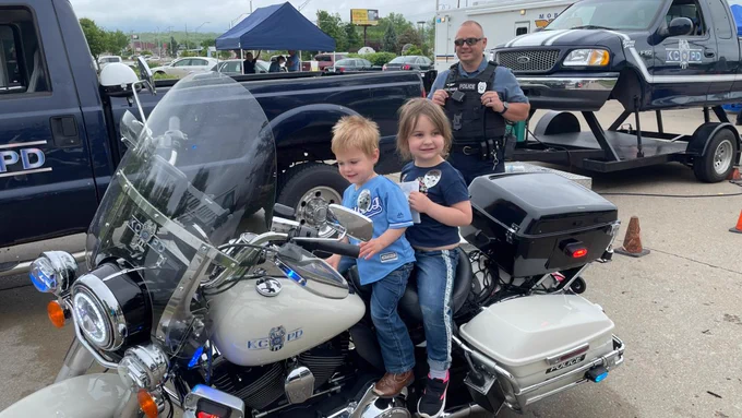 kids exploring police motorcycle at Martin City's Law Enforcement Appreciation event in 2021