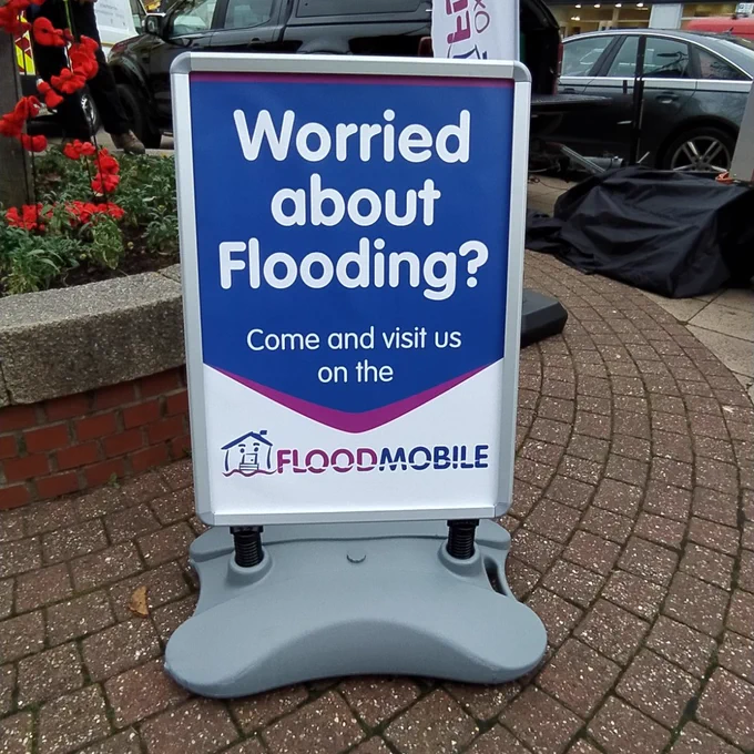A flooding sign in a town centre 