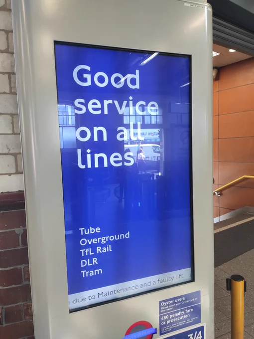 An electronic sign saying good services on all lines, white text, blue background