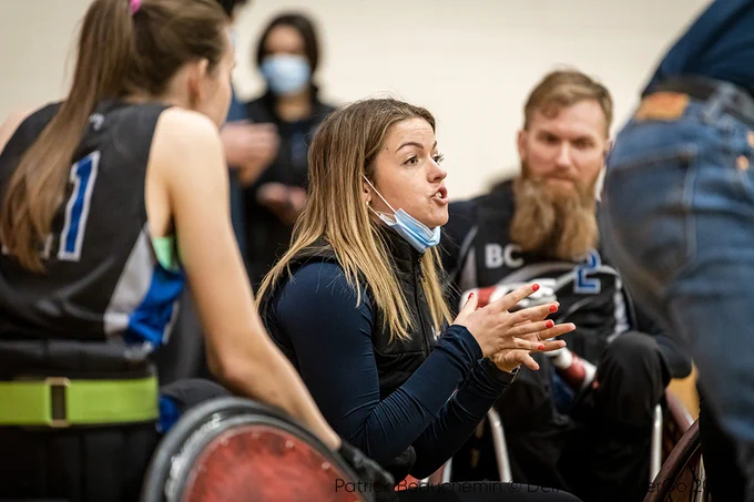 Coach Kendra Todd provides instructions and encouragement during a timeout. 
