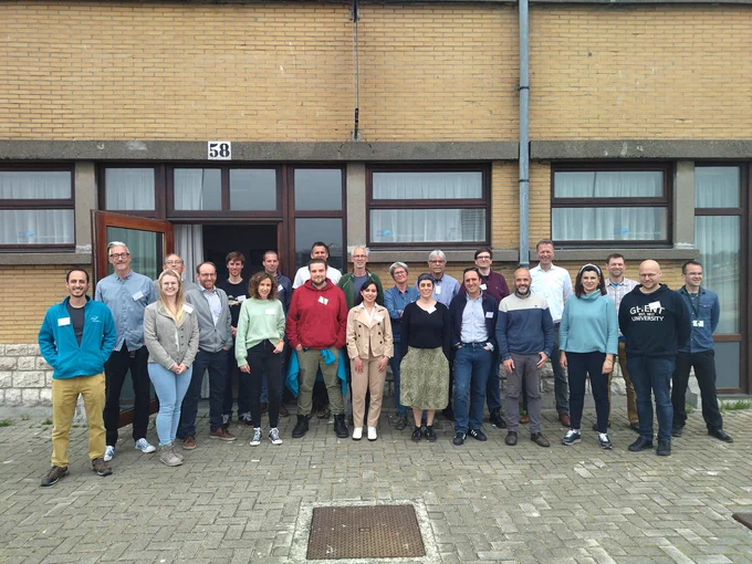 Photograph of the partners attending the meeting on site
