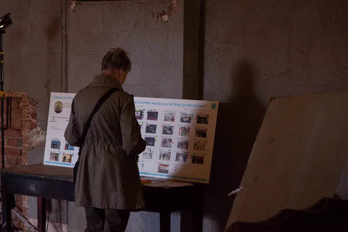 A visitor reading an interpretation panel